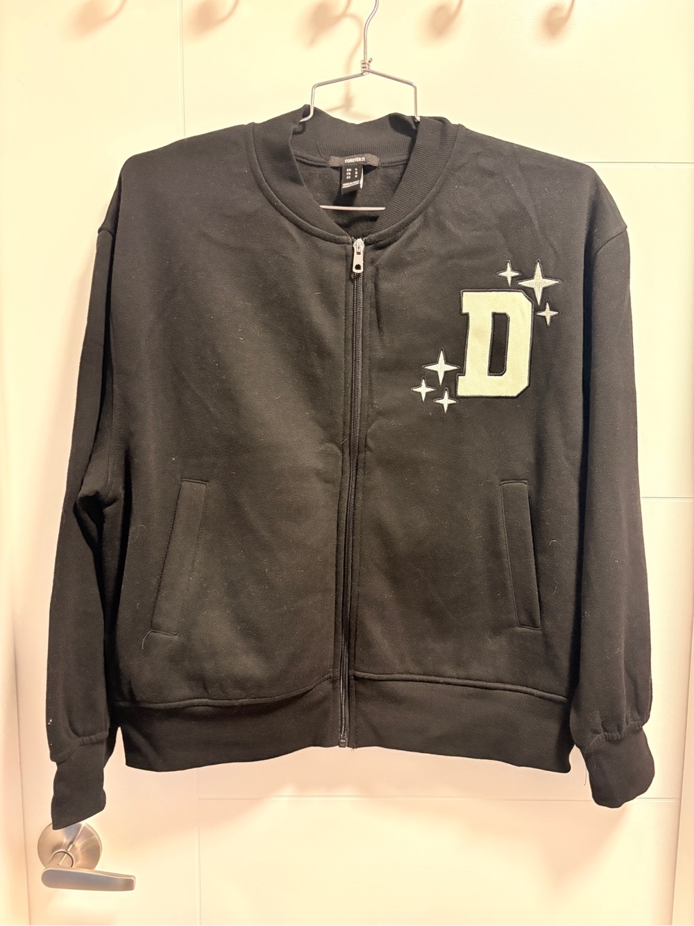 Unisex Black Zip-Up Jacket with 'D' Patch
Never worn